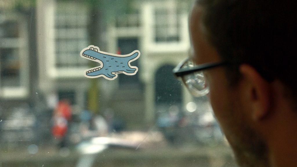 GVBeestje sticker on a tram window